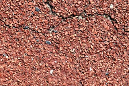 Detailed view on asphalt surfaces of different streets and roads with cracks in a close upの写真素材