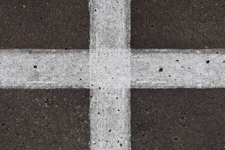 Detailed view on asphalt surfaces of different streets and roads with cracks in a close upの写真素材