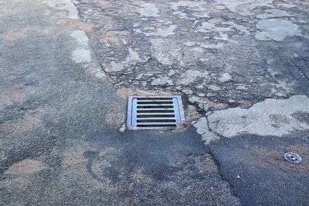 Detailed view on asphalt surfaces of different streets and roads with cracks in a close up