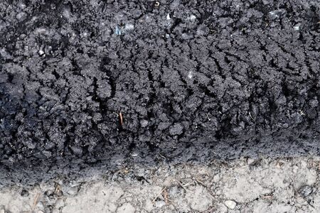 Detailed view on asphalt surfaces of different streets and roads with cracks in a close up