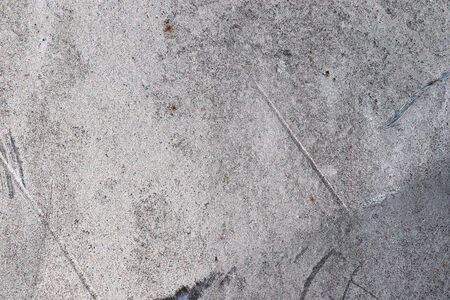 Detailed view on aged concrete walls fronm different modern and hostorical buildings with cracks and...