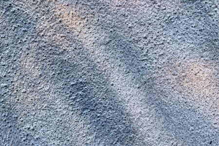 Detailed view on aged concrete walls fronm different modern and hostorical buildings with cracks and...