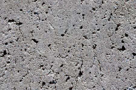 Detailed view on aged concrete walls fronm different modern and hostorical buildings with cracks and...