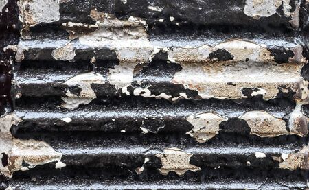 Detailed view on aged concrete walls fronm different modern and hostorical buildings with cracks and...
