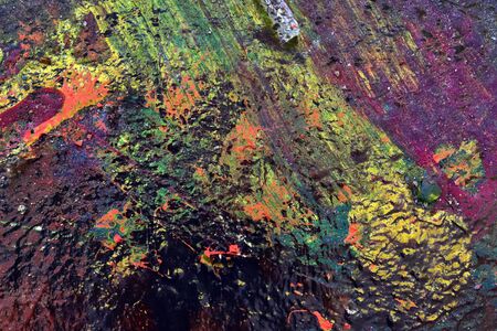 Colorful graffiti paint splashes on the wall and ground at a lost place ruin in Kiel northern germanyの写真素材