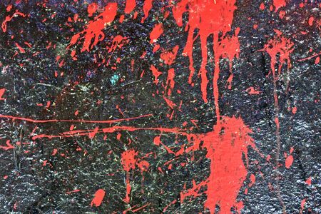 Colorful graffiti paint splashes on the wall and ground at a lost place ruin in Kiel northern...
