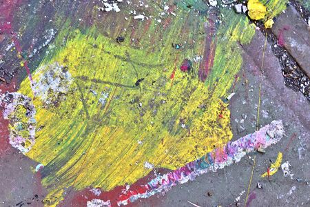 Colorful graffiti paint splashes on the wall and ground at a lost place ruin in Kiel northern germanyの写真素材