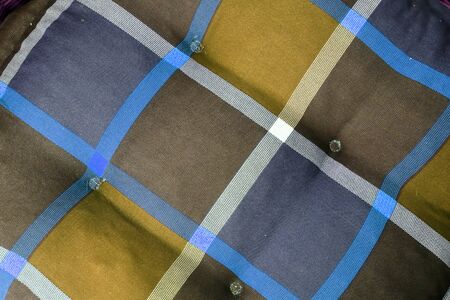 Detailed close up view on samples of cloth and fabrics in different colors found at a fabrics...