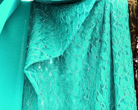 Detailed close up view on samples of cloth and fabrics in different colors found at a fabrics...