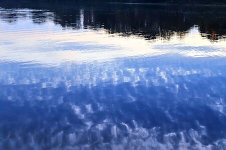Detailed close up view on water surfaces with waves and ripples and the sunlight reflecting at the...