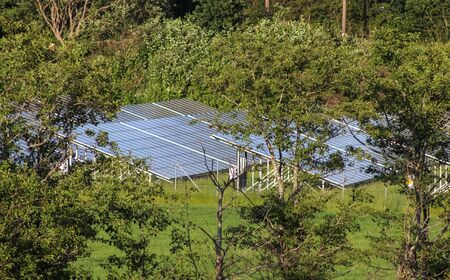 Generating clean energy with solar modules in a big park in northern Europe.