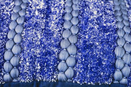 Detailed close up view on samples of cloth and fabrics in different colors found at a fabrics market.の写真素材
