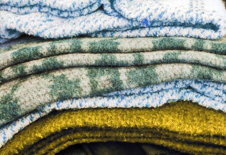 Detailed close up view on samples of cloth and fabrics in different colors found at a fabrics market.の写真素材
