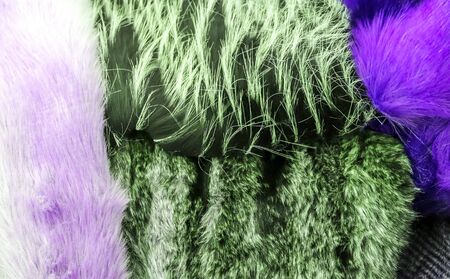 Detailed close up view on samples of cloth and fabrics in different colors found at a fabrics...