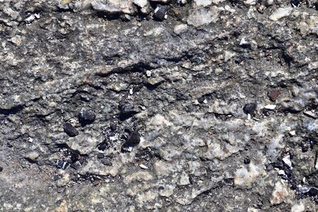 Granite stone texture in a detailed close up view in a high resolution.