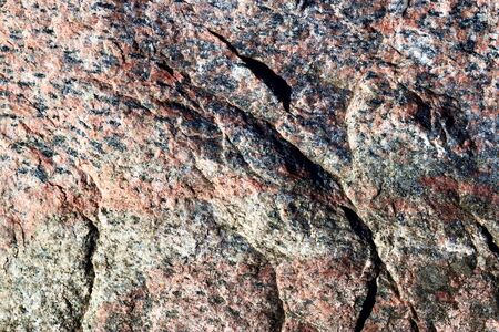 Granite stone texture in a detailed close up view in a high resolution.