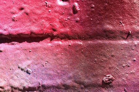 High resolution texture of colorful graffiti paint on conrete and brick walls in red blue purple and...