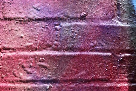 High resolution texture of colorful graffiti paint on conrete and brick walls in red blue purple and...