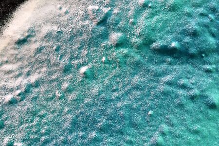 High resolution texture of colorful graffiti paint on conrete and brick walls in red blue purple and silverの写真素材