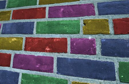 Beautiful rainbow colored bricks on an old vintage wall texture
