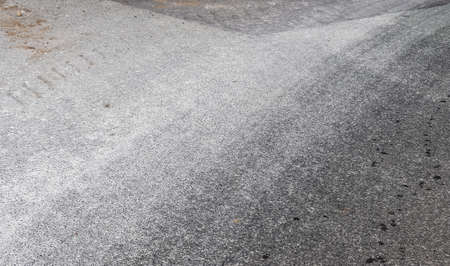 Detailed view on asphalt surfaces of different streets and roads with cracks in a close up