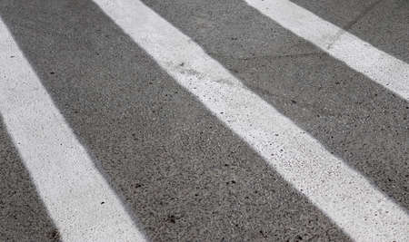 Detailed view on asphalt surfaces of different streets and roads with cracks in a close up