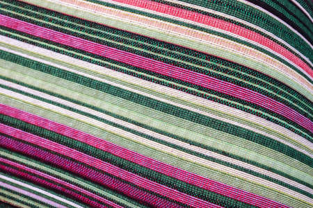 Detailed close up view on samples of cloth and fabrics in different colors found at a fabrics market.の写真素材