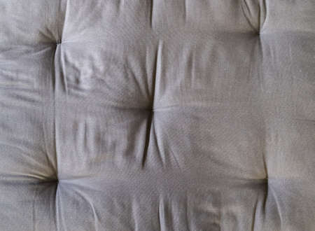Detailed close up view on samples of cloth and fabrics in different colors found at a fabrics...
