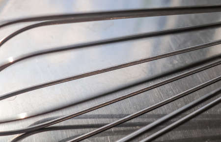 Manual hand mixer for blending, beating, Egg beater isolated on metal background. Metal stainless steel kitcenware utensilの写真素材