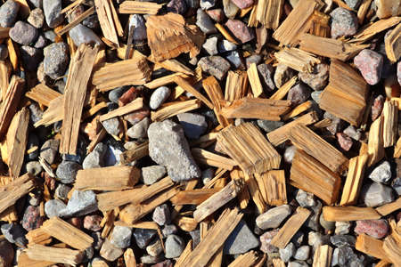 Detailed close up view on pebbles and stones on a gravel ground texture in high resolution