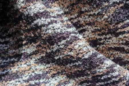 Detailed close up view on samples of cloth and fabrics in different colors found at a fabrics...