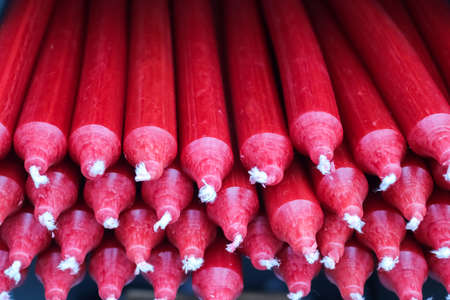 Stacks of candles with selective focus in a shelf shown in a small storeの写真素材