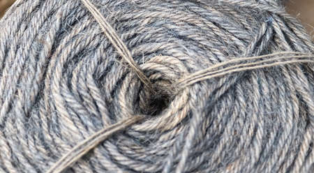 Stranded threads. A tangle of yarn. Entangled confusing thread on a roll