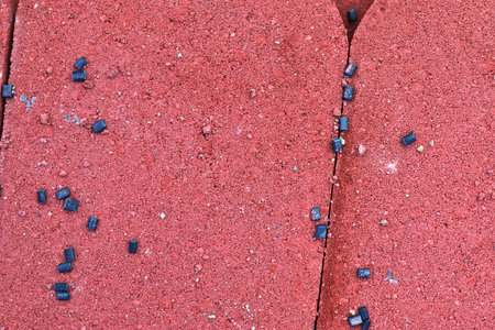 Detailed close up texture on structured floor tiles on a groundの写真素材