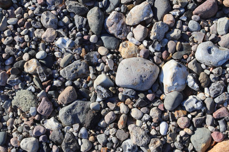 Beautiful stone pebbles at the beach of the baltic sea in the north of Germany