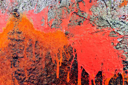Detailed close up view of aged and weathered concrete walls with cracks and paint in high resolution
