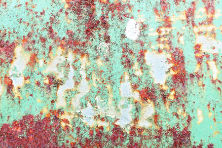 Detailed close up view of aged and weathered concrete walls with cracks and paint in high resolution