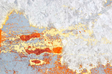 Detailed close up view of aged and weathered concrete walls with cracks and paint in high resolution
