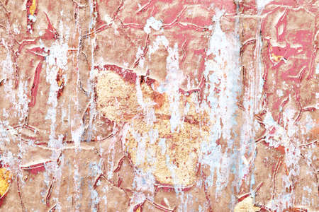 Detailed close up view of aged and weathered concrete walls with cracks and paint in high resolution