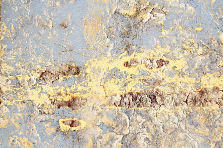 Detailed close up view of aged and weathered concrete walls with cracks and paint in high resolution