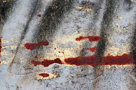 Detailed close up view of aged and weathered concrete walls with cracks and paint in high resolution