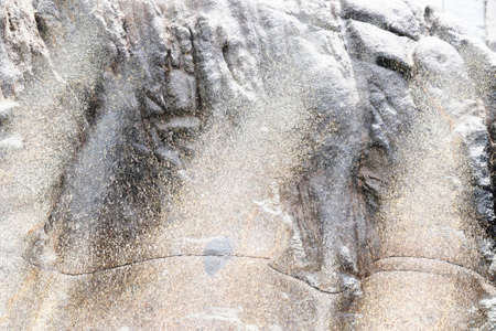 Detailed close up view of aged and weathered concrete walls with cracks and paint in high resolutionの写真素材