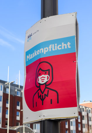 German sign during corona virus telling to wear a face mask for protection during the 2020/2021 corona pandemicのeditorial素材