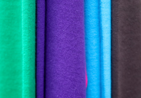Detailed close up view on samples of cloth and fabrics in different colors found at a fabrics...