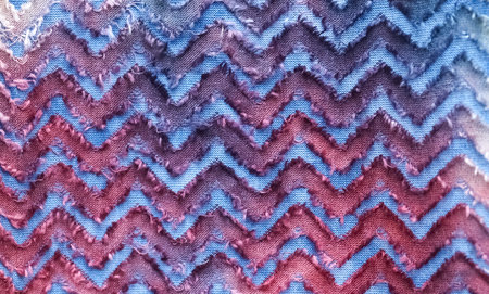 Detailed close up view on samples of cloth and fabrics in different colors found at a fabrics...