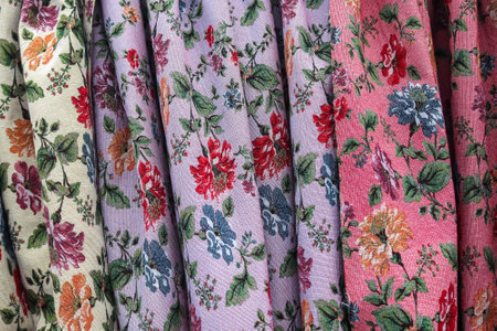 Detailed close up view on samples of cloth and fabrics in different colors found at a fabrics market.の写真素材