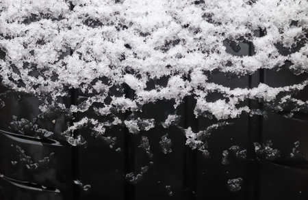 Closeup of car tires in winter covered with snowの写真素材