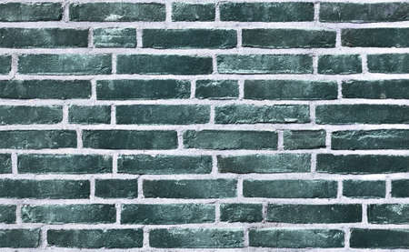 Detailed view at a colorful old and weathered brick wall texture. Panoramic background.の写真素材