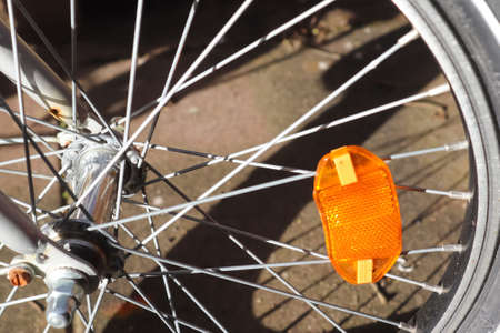 Selective focus close up view at a bicycle wheel with metal spokesの写真素材