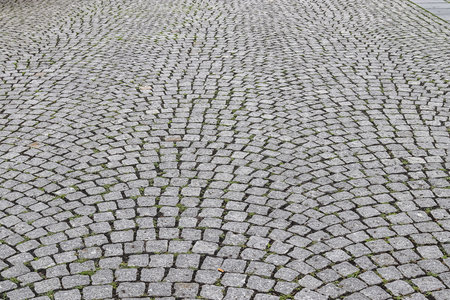 Close up view on old historical cobblestone roads and walkways all over europeの写真素材